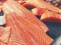 Sliced raw salmon or fresh salmon. Salmon fillets for sale at market displayed with a patchwork effect. Many fresh salmon fish Royalty Free Stock Photo