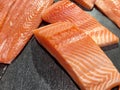 Sliced raw salmon or fresh salmon. Salmon fillets for sale at market displayed with a patchwork effect. Many fresh salmon fish Royalty Free Stock Photo