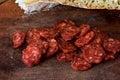 Sliced Raw Sausage Salami on Wooden Cutting Board Ready to Eat/ Closeup still life food photography Royalty Free Stock Photo