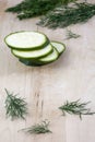 Sliced raw zucchini with fennel on the wooden background Royalty Free Stock Photo