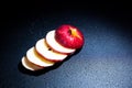 Sliced red apple isolated on black background. Royalty Free Stock Photo