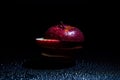 Sliced red apple isolated on black background. Royalty Free Stock Photo