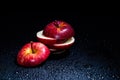 Sliced red apple isolated on black background. Royalty Free Stock Photo