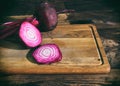 Sliced red beet on a wooden kitchen board