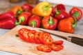 Sliced red bell pepper (paprika) on a kitchen cutting boar Royalty Free Stock Photo