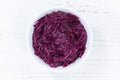 Sliced red cabbage from above bowl wooden board Royalty Free Stock Photo