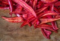 Sliced red cayenne chili pepper on an old board Royalty Free Stock Photo