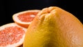 Sliced red grapefruit isolated on black background Royalty Free Stock Photo