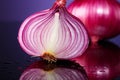 Sliced red onion exhibits translucent layers on a pink purple reflection Royalty Free Stock Photo