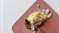 Sliced red onion, white onion, galangal on red kitchen board Royalty Free Stock Photo