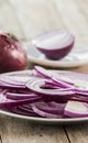 Sliced red onion on white plate Royalty Free Stock Photo