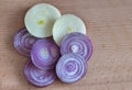 Sliced red onion on wooden background. Sliced red onion rings. Top view Royalty Free Stock Photo