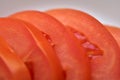 Sliced red ripe tomatoes on a white plate Royalty Free Stock Photo