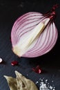 Sliced red spanish onion with bay leaf and sea salt