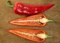 Sliced red sweet pepper isolated on wooden background Royalty Free Stock Photo