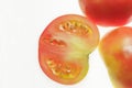 Sliced red tomato on white, with blank space on the left Royalty Free Stock Photo