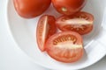 Sliced red tomatoes close-up on a plate Royalty Free Stock Photo