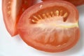 Sliced red tomatoes close-up on a plate Royalty Free Stock Photo