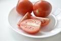 Sliced red tomatoes close-up on a plate Royalty Free Stock Photo