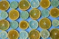 Sliced rings of orange, lemon, lime on blue background. . Healthy food, detox, diet. Royalty Free Stock Photo