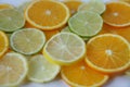 Sliced rings of orange and lemon, and lime isolated on white background Royalty Free Stock Photo