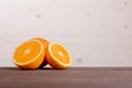 Sliced ripe appetizing delicious orange on cutting board brown t Royalty Free Stock Photo