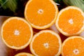 sliced ripe appetizing orange on a cutting board on a green table Royalty Free Stock Photo