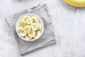 Sliced ripe banana in bowl. Royalty Free Stock Photo