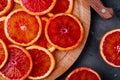 Sliced ripe juicy Sicilian Blood oranges on dark background. Royalty Free Stock Photo