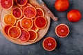 Sliced ripe juicy Sicilian Blood oranges on dark background. Royalty Free Stock Photo