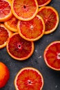 Sliced ripe juicy Sicilian Blood oranges on dark background. Royalty Free Stock Photo