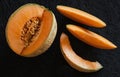 Sliced ripe melon on black background Royalty Free Stock Photo