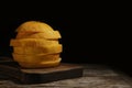 Sliced ripe melon on table against black background Royalty Free Stock Photo