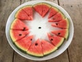 Sliced ripe watermelon place a sort of white plate around. Royalty Free Stock Photo