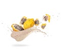 Sliced ripe yellow dragon fruits pitahaya with splashes of fresh juice on a white background