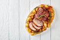 Sliced roast pork roulade with potatoes Royalty Free Stock Photo