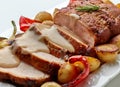 sliced roast pork with vegetables and sauce Royalty Free Stock Photo