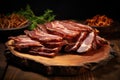 Sliced roast pork on a wooden cutting board