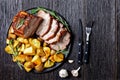 Sliced pork loin with baked potato on a plate Royalty Free Stock Photo