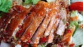 Sliced roasting Traditional Christmas Duck dressing with salad tomatoes and spicy sweet sauce at gourmet chinese restaurant