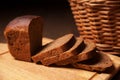 Sliced rye bread and basket closeup Royalty Free Stock Photo