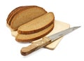 Sliced rye bread on a board with a knife Royalty Free Stock Photo