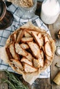 Sliced rye bread crackers with cereals. Basket with breadcrumbs on a wooden background close-up Royalty Free Stock Photo