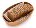 Sliced rye bread in a wicker basket, isolated on a white background Royalty Free Stock Photo