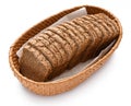 Sliced rye bread in a wicker basket, isolated on a white background Royalty Free Stock Photo