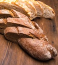 Sliced rye,white bread on an old wooden table Royalty Free Stock Photo