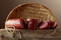 Sliced salami on a old wooden board Royalty Free Stock Photo