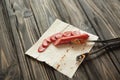 Sliced salami on pita bread on wooden background