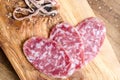 Sliced salami on a wood board Royalty Free Stock Photo