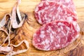 Sliced salami on a wood board Royalty Free Stock Photo